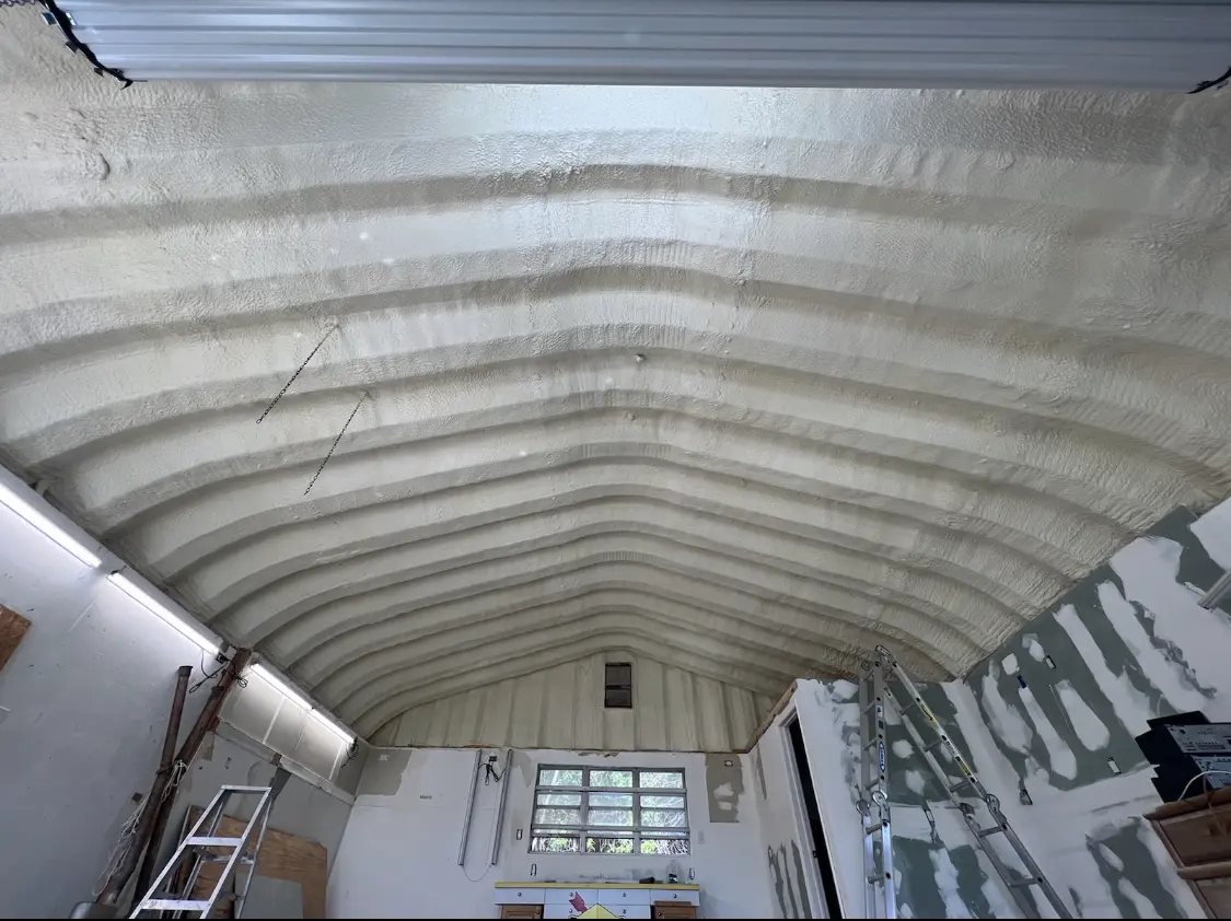 Spray polyurethane foam applied to the underside of a metal roof deck in Bailey's Crossroads
